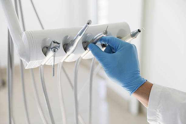 Professional Tooth Extraction technician working in Almont, MI